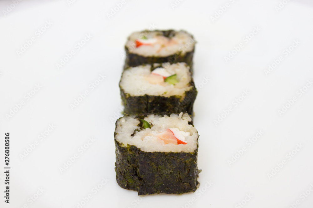 Japanese cuisine, rice sushi and fish - closeup Japanese cuisine, rice sushi and fish - closeup
