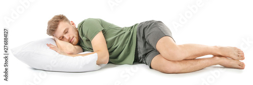 Handsome sleeping man on wh...
