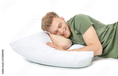Handsome sleeping man on wh...