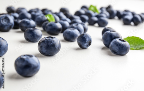 Many ripe blueberry on white background