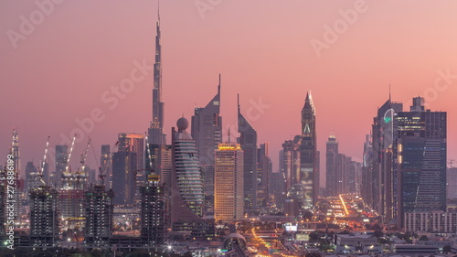 Dubai skyline after sunset with beautiful city center lights and Sheikh Zayed road traffic timelapse, Dubai, United Arab Emirates © neiezhmakov