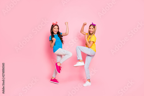 Full size photo of cheerful kids scream yeah have aims fortune wear pants trousers headbands isolated over pink background