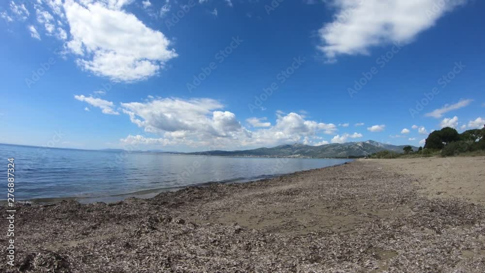 Schinias beach early in the morning time lapse. Clouds moving above the empty beach. Location near Athens east Attica Greece. Schinias beach early in the morning time lapse. Clouds moving above the empty beach. Location near Athens east Attica Greece.