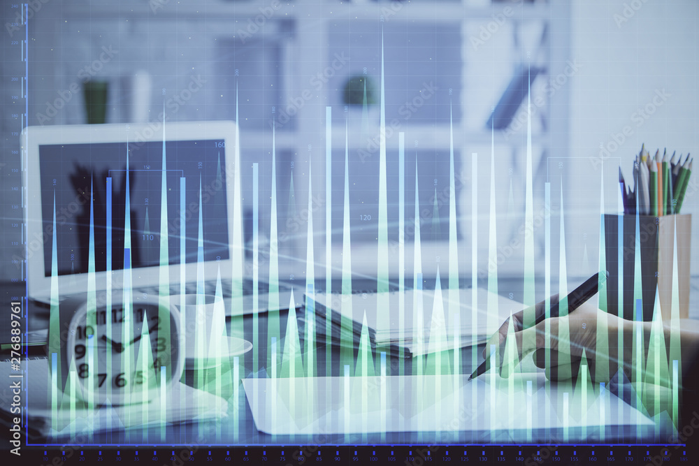 Financial graph displayed on woman's hand taking notes background. Concept of research. Multi exposure Financial graph displayed on woman's hand taking notes background. Concept of research. Multi exposure