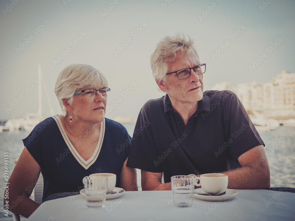Retired couple enjoying coffee on a resort Retired couple enjoying coffee on a resort