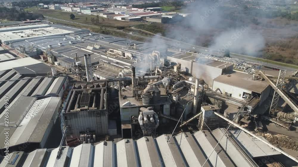 Aerial: Industrial zone with a pipes White smoke is poured from the factory pipe Environmental pollution Aerial: Industrial zone with a pipes White smoke is poured from the factory pipe Environmental pollution