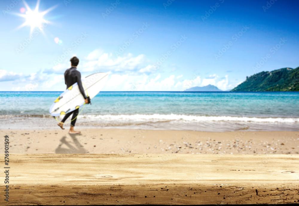 Desk of free space and summer beach background 