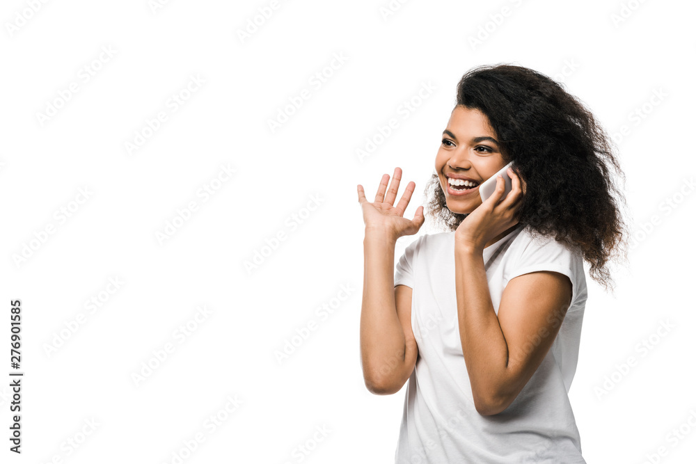happy african american girl talking on smartphone and gesturing isolated on white happy african american girl talking on smartphone and gesturing isolated on white