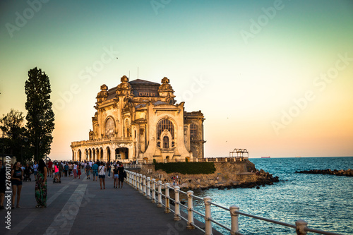 Old casino in Constanta on promenade by the black sea, at the sunset. photo