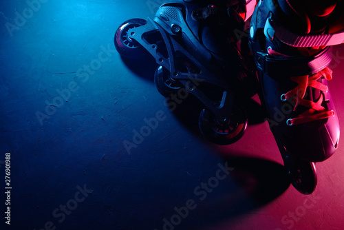 Fotografie Close up view of roller skates inline skate or rollerblading on dark grunge back