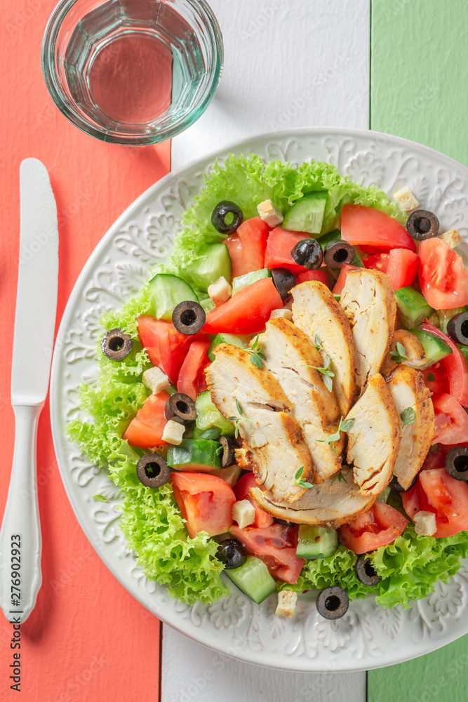 Tasty Caesar salad with chicken, tomatoes and lettuce Tasty Caesar salad with chicken, tomatoes and lettuce