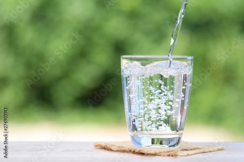Closeup Glass of water on table nature background