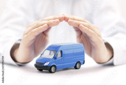 Transport blue van car protected by hands 