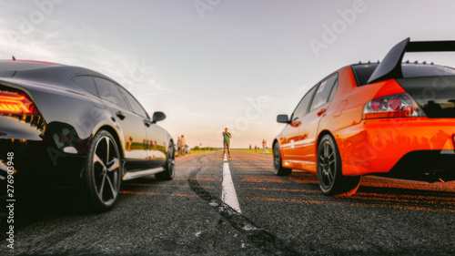 sport car at the start, speed competition, drag racing, high speed photo