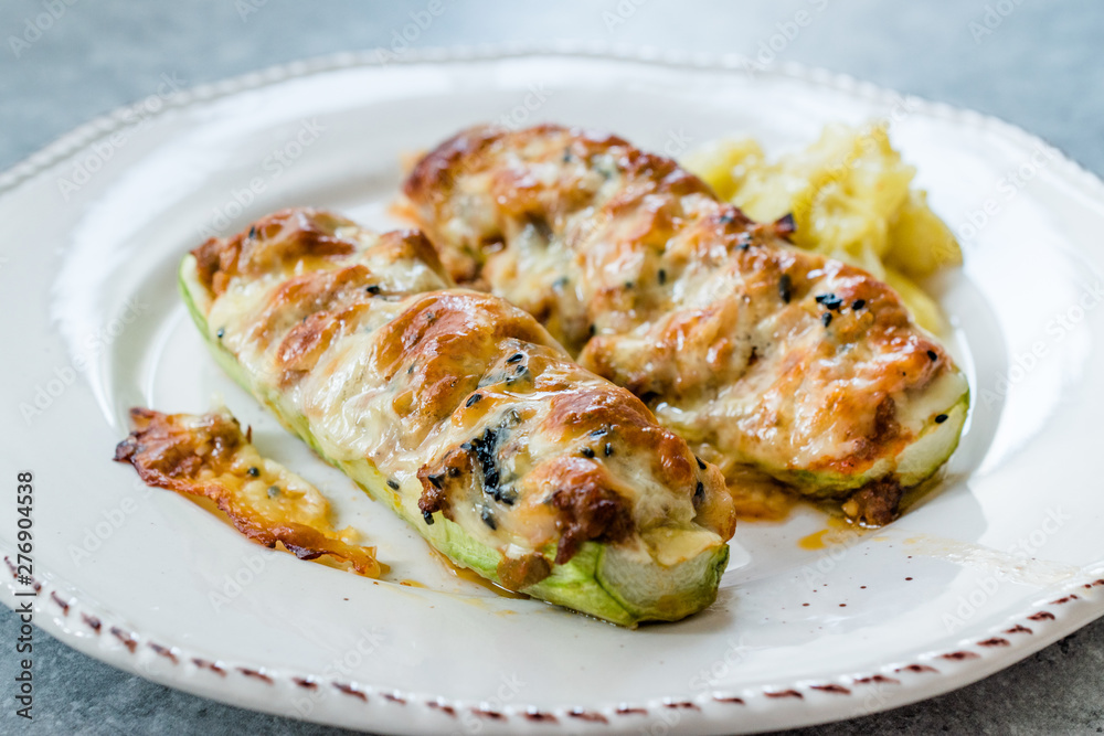 Baked Zucchini Courgettes Stuffed with Cheese and Dill.