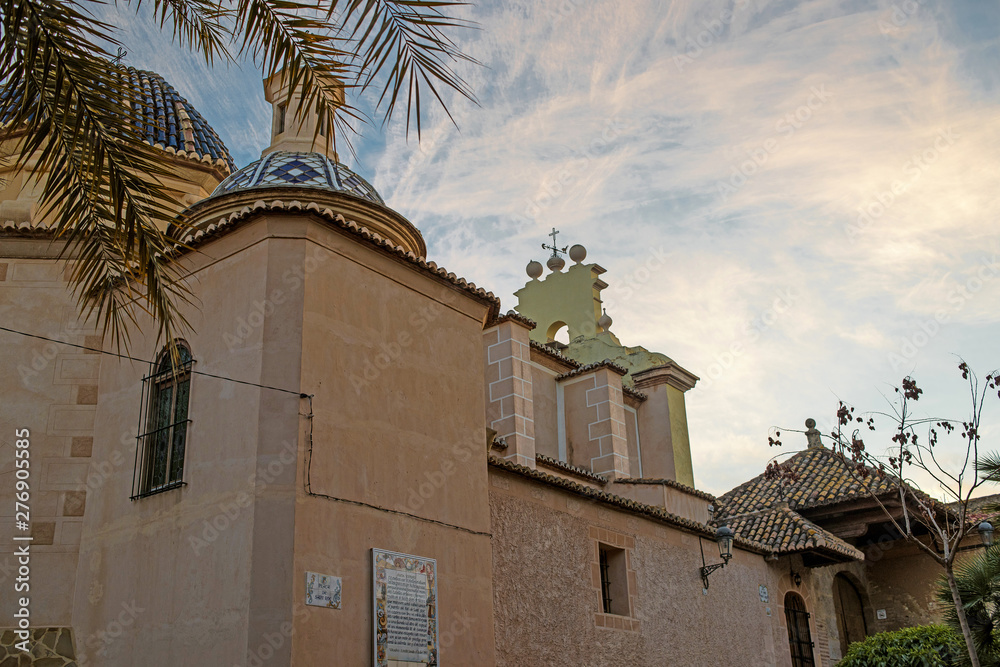 Valencia, Spain: 01.23.2019; The branch of palm tree and cathedral