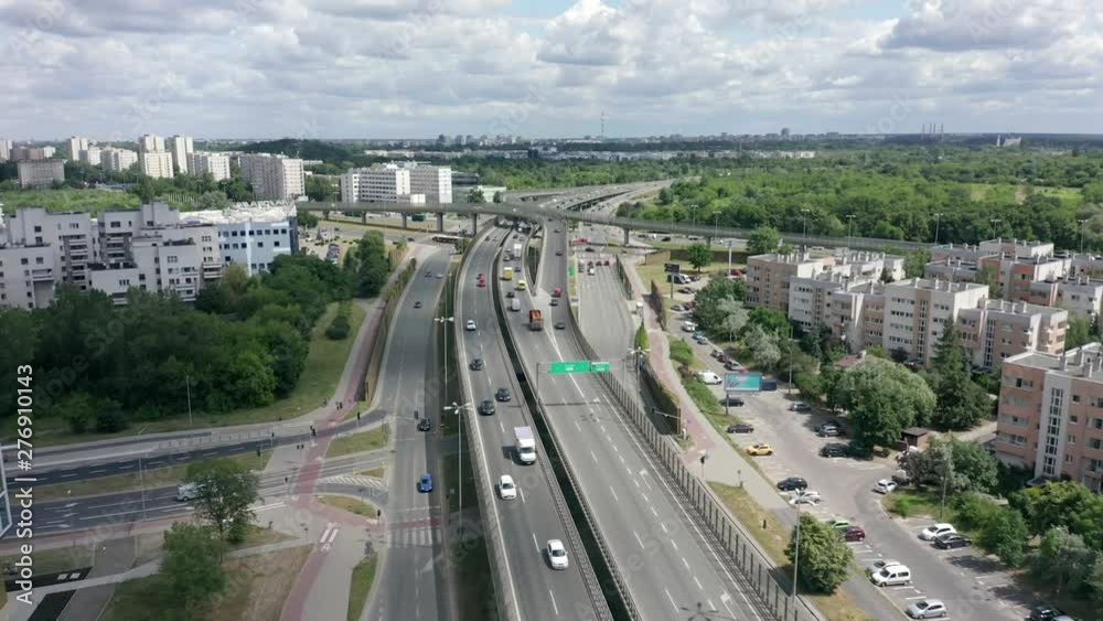 Aerial view of the busy highway of the city of Warsaw. Top view from the height of a bird's eye view of the Metropolis, interchange, city, elevated transport, expressway, large urban zone, Poland. Aerial view of the busy highway of the city of Warsaw. Top view from the height of a bird's eye view of the Metropolis, interchange, city, elevated transport, expressway, large urban zone, Poland.