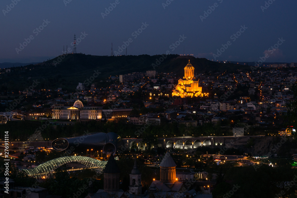 tblisi city panorama at night sameba church and peace bridge