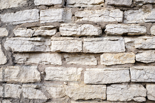 Old stone wall of different stones, texture for your design.