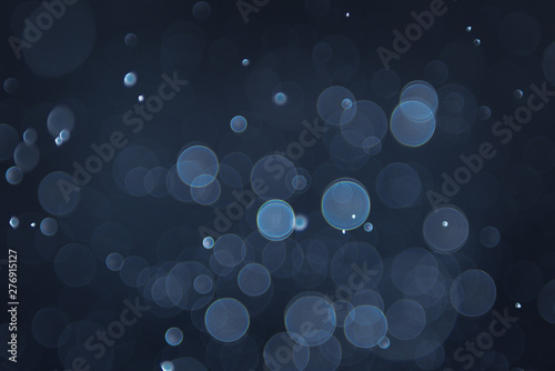 abstract sparkle bokeh light effect with navy blue background