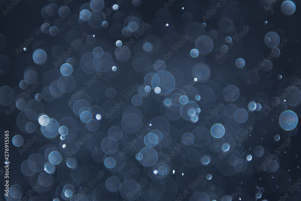 abstract sparkle bokeh light effect with navy blue background abstract sparkle bokeh light effect with navy blue background