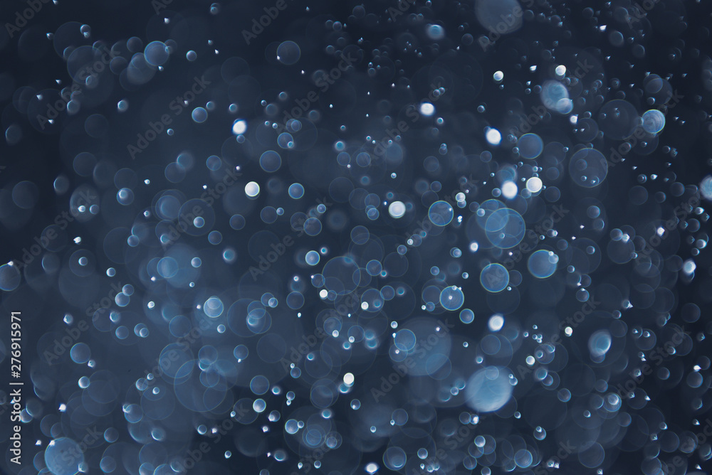 abstract sparkle bokeh light effect with navy blue background abstract sparkle bokeh light effect with navy blue background