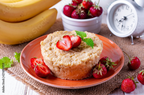 Fresh homemade cake in the microwave with fresh strawberries photo