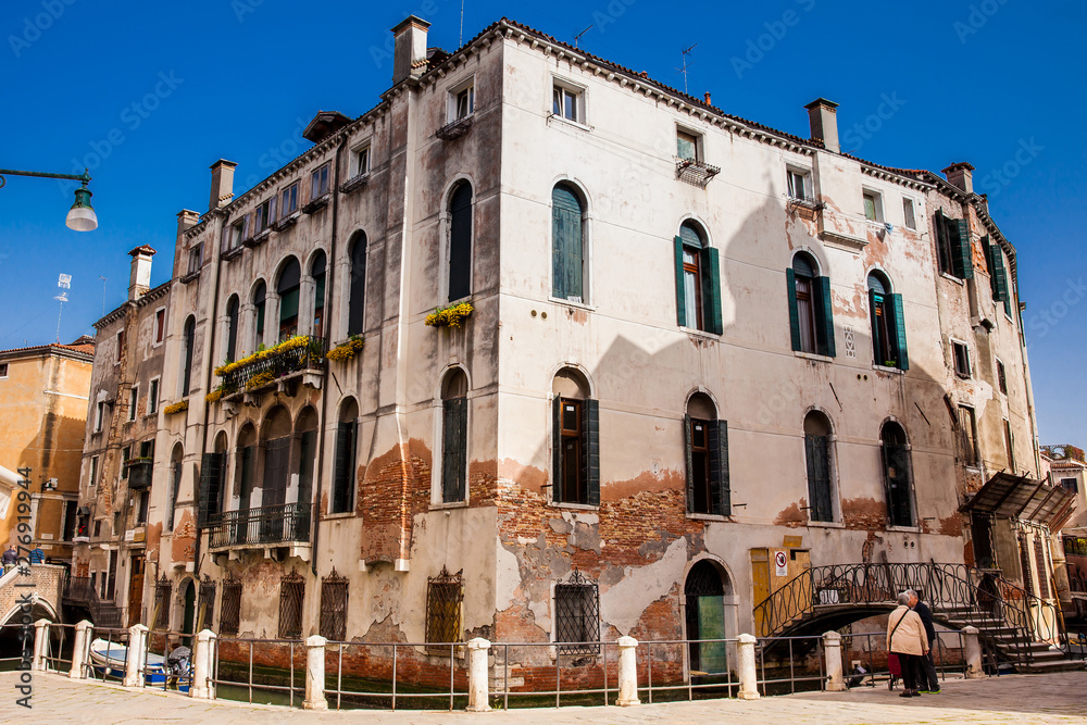 The picturesque buildings and canals at the Campo della Maddalena of Venice in a sunny early spring day