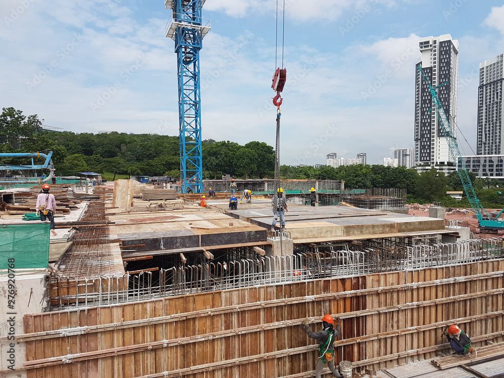 Naklejka premium Building substructure and super-structure under construction using the open cut method. It is commencing after the foundation stage using the conventional method