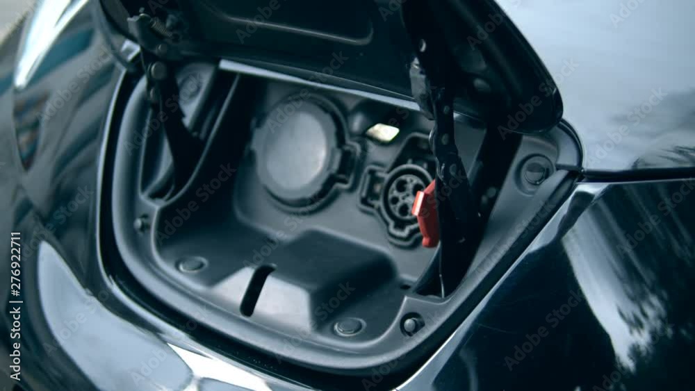 A nozzle is being removed from an electrocar A nozzle is being removed from an electrocar