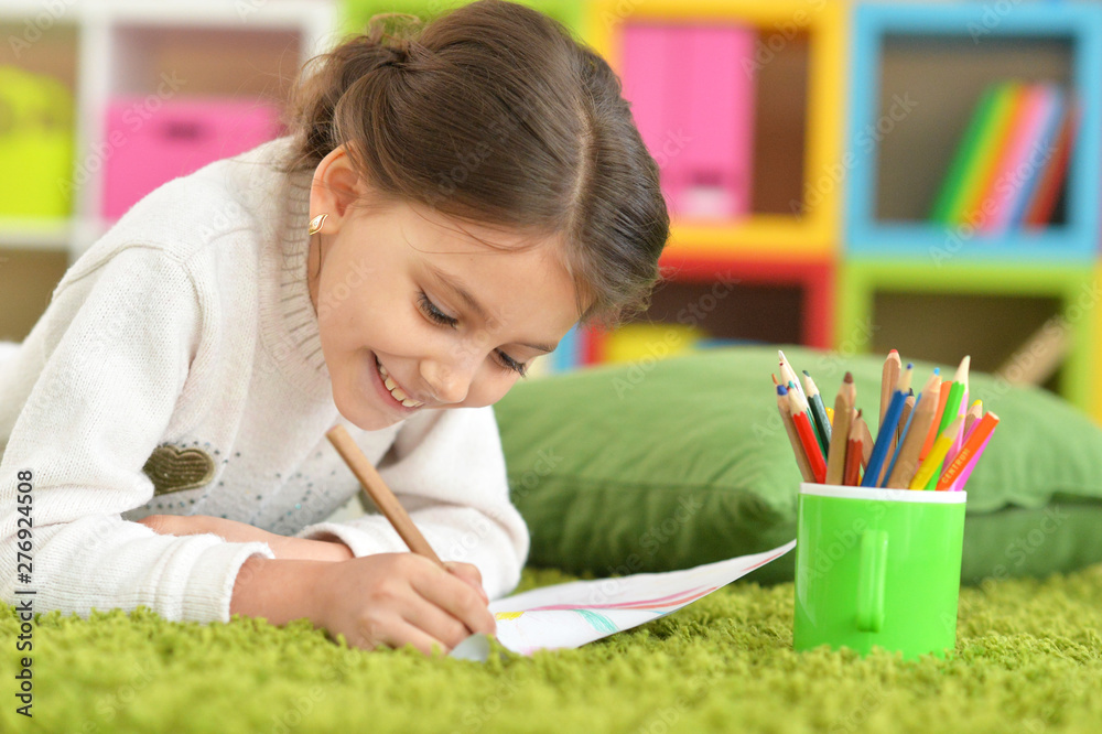 Portrait of cute beautiful smiling girl drawing and posing at home Portrait of cute beautiful smiling girl drawing and posing at home