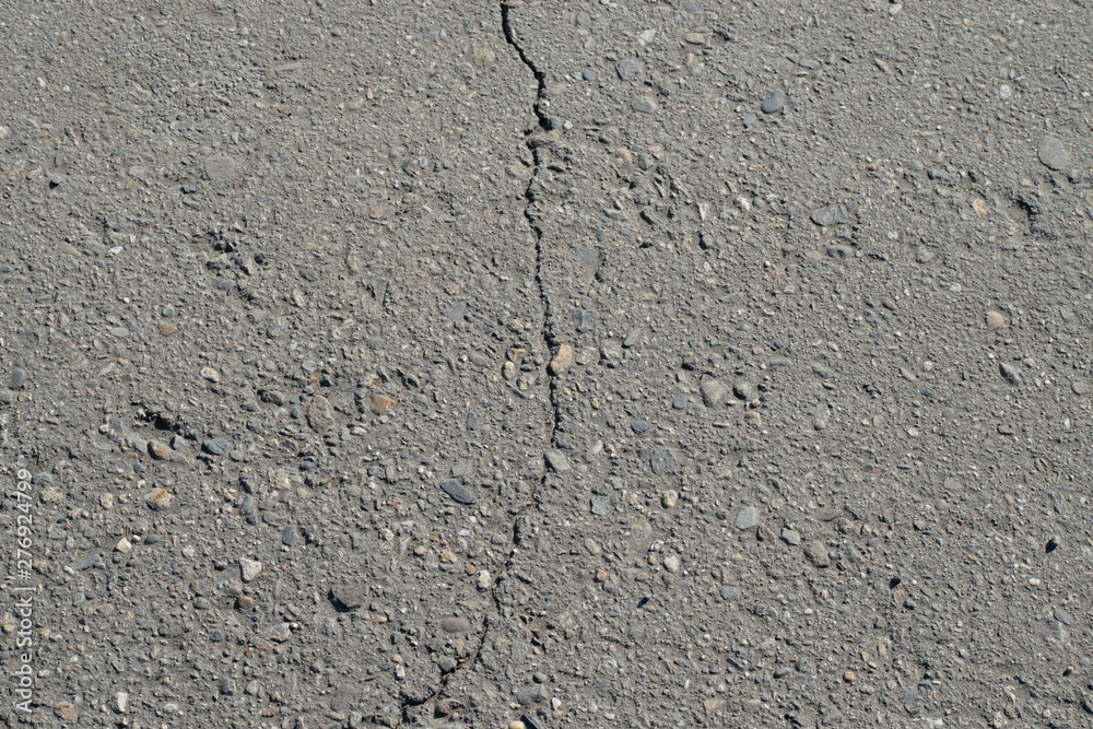 Obraz premium Asphalt surface texture with crack.