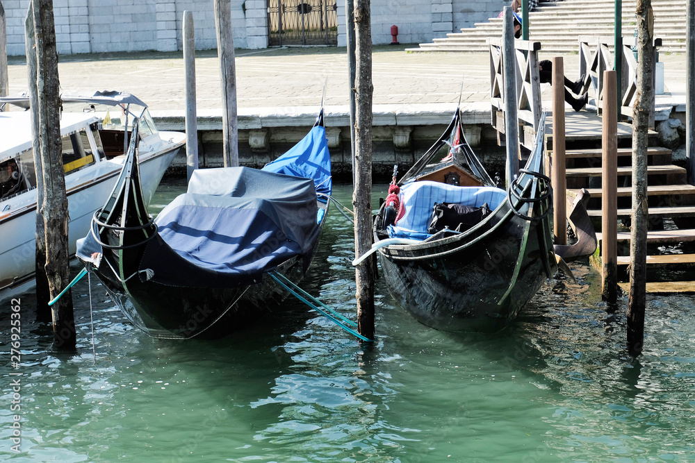 two gondolas moored on Grand Canal in VEnice, Italy