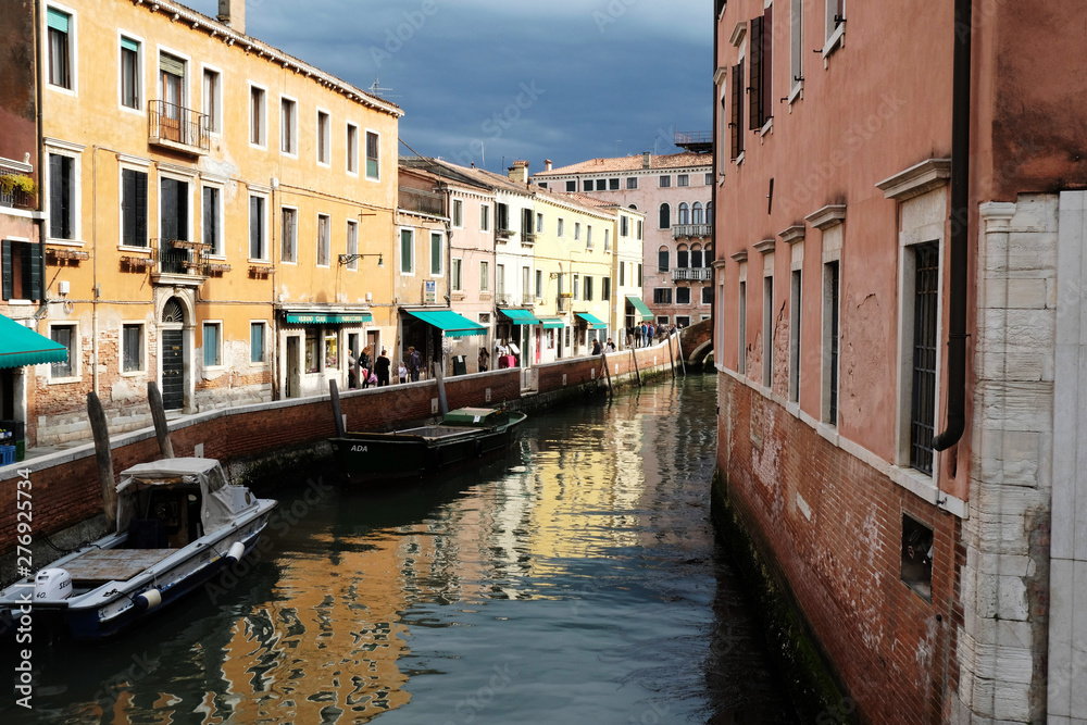houses over canal in Venice before storm