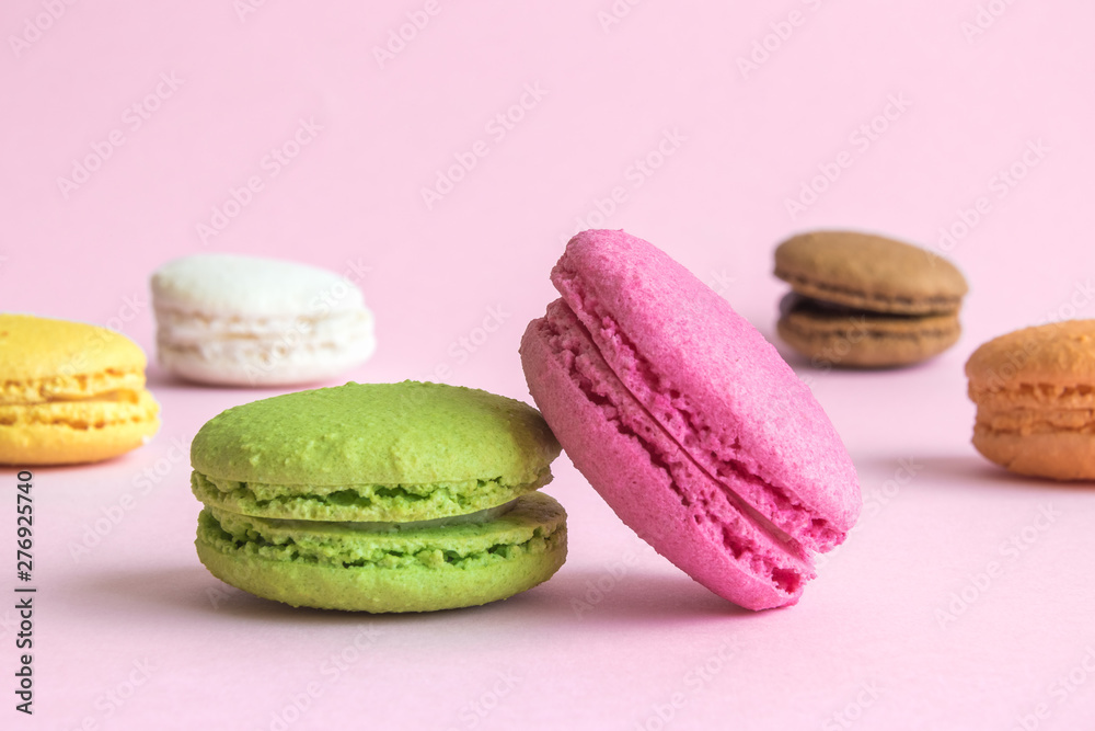 Beautiful multicolored macaroons on pastel pink background. Beautiful multicolored macaroons on pastel pink background.