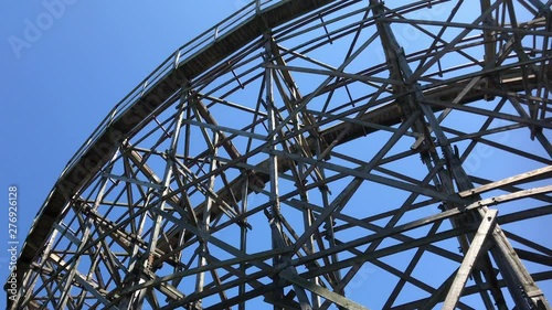 Looking up at wooden roller coaster design photo