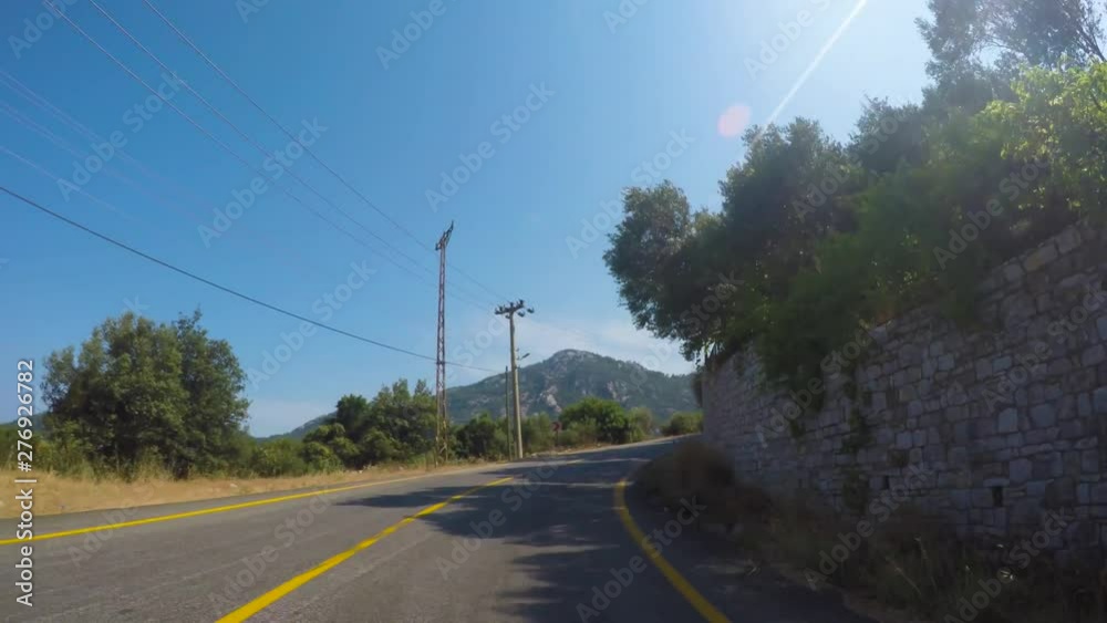 car rides on a mountain forest road with turns in summer in Sunny car rides on a mountain forest road with turns in summer in Sunny