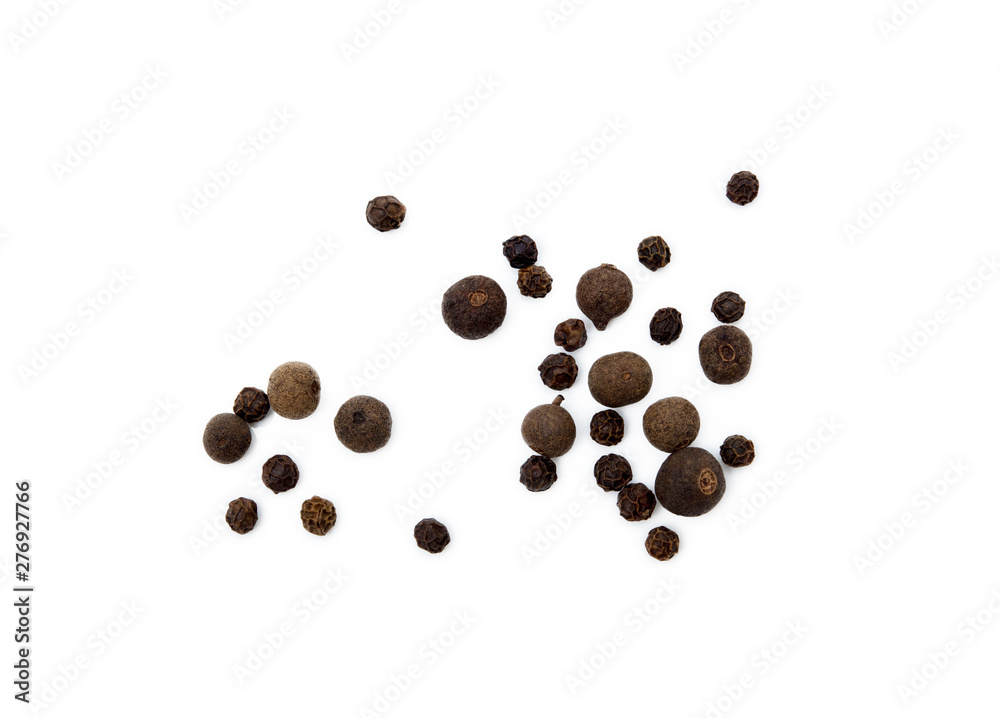 Scattered allspice and pepper isolated on white background Scattered allspice and pepper isolated on white background