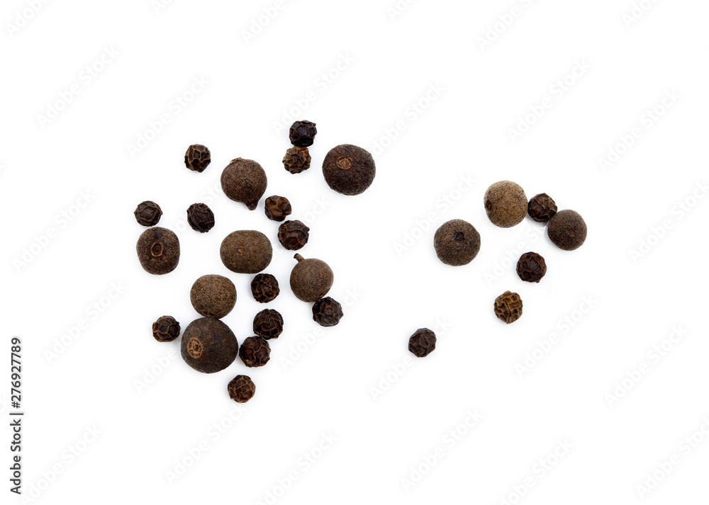 Scattered allspice and pepper isolated on white background Scattered allspice and pepper isolated on white background