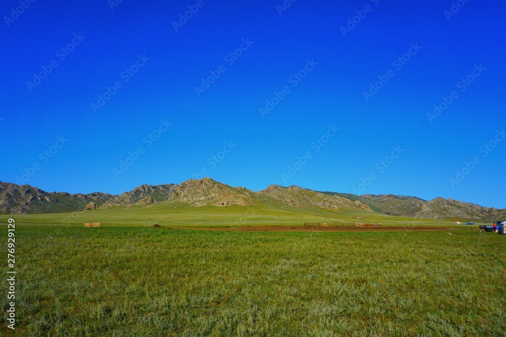 Obraz premium Blue sky infront of a mountain in rural Mongolia