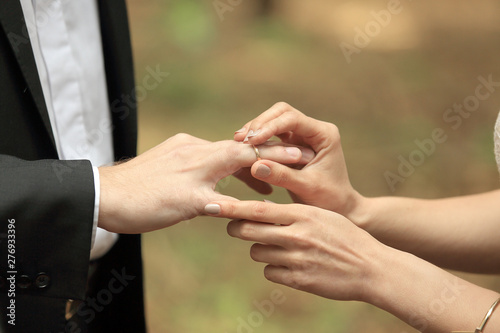 close, up., bride, putting, wedding, ring, grooms, finger.