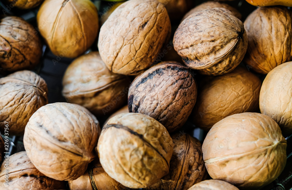 The unshelled walnuts in the shell The unshelled walnuts in the shell