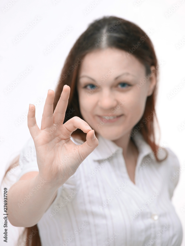 successful modern girl showing okay gesture.isolated on white. successful modern girl showing okay gesture.isolated on white.