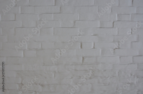 Antique white brick wall covered with paint.