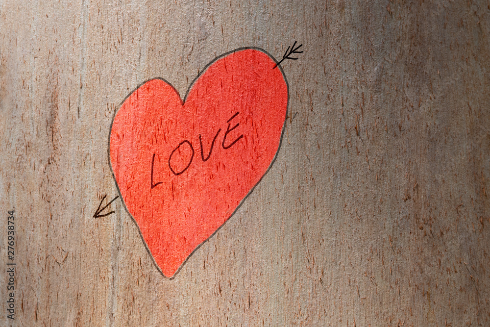 Love heart hand and love text painted on a trunk tree. Love concept Love heart hand and love text painted on a trunk tree. Love concept