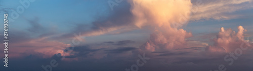 Panoramic View of a Dramatic Cloudscape during colorful sunrise.