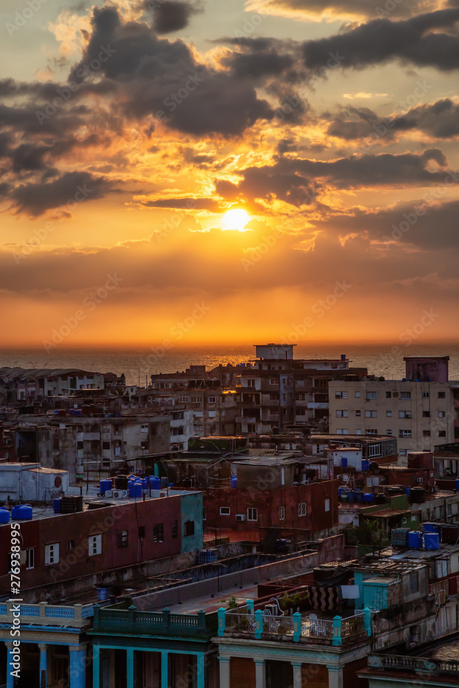 Aerial view of the residential neighborhood in the Havana City, Capital of Cuba, during a colorful and rainy sunset. Aerial view of the residential neighborhood in the Havana City, Capital of Cuba, during a colorful and rainy sunset.