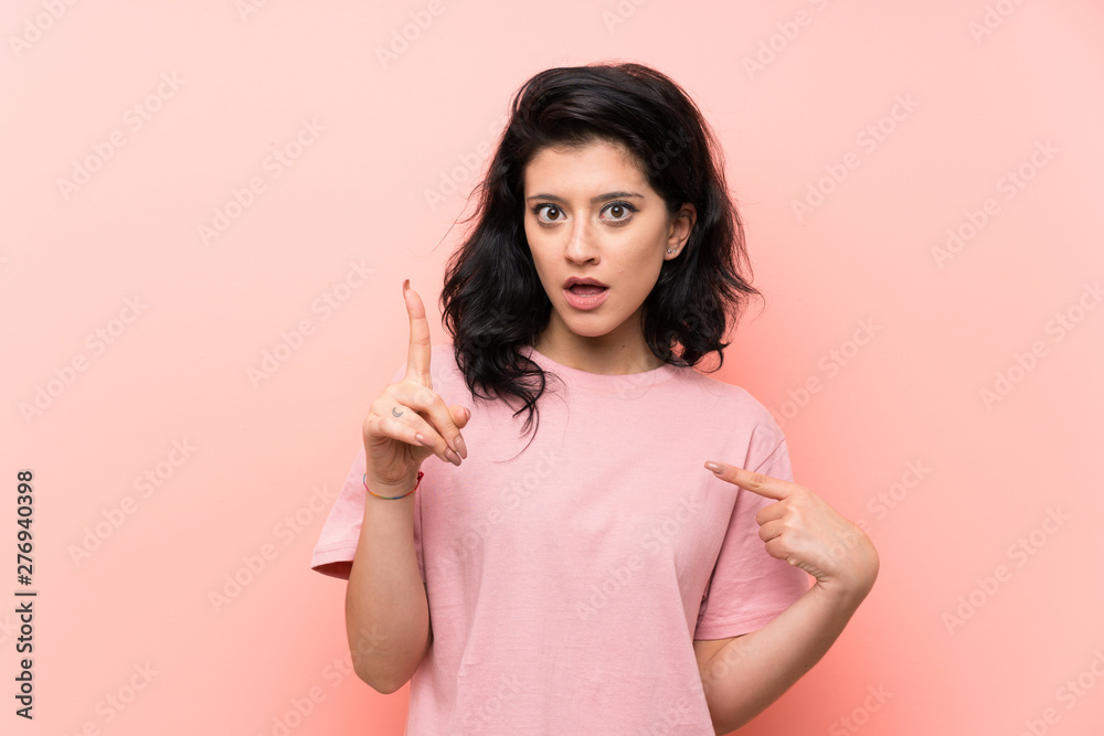 Young woman over isolated pink background with surprise facial expression Young woman over isolated pink background with surprise facial expression