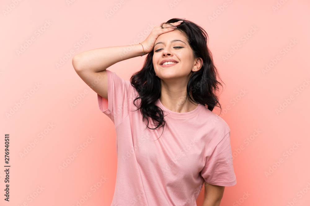 Young woman over isolated pink background laughing Young woman over isolated pink background laughing