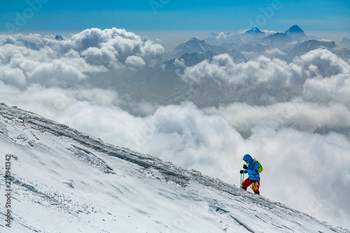 mountaineer climbing mount Elbrus in winter